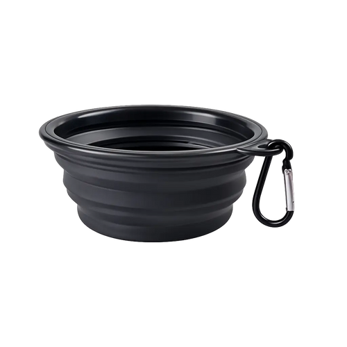 Collapsible travel bowl for dogs in black folded flat with carabiner clip